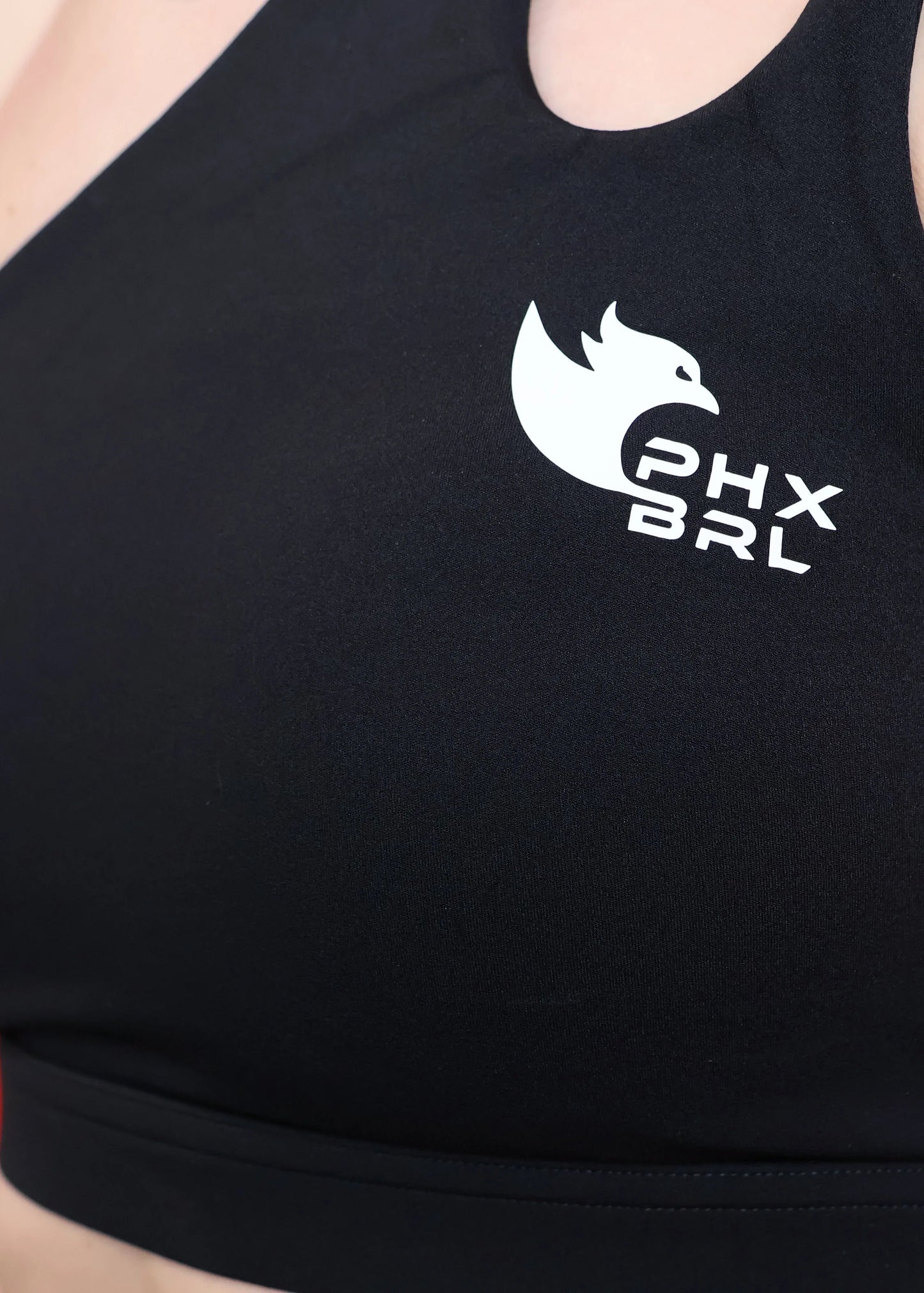 Détail logo PHX BRL sur brassière femme FURY Phoenix Barbell Signature